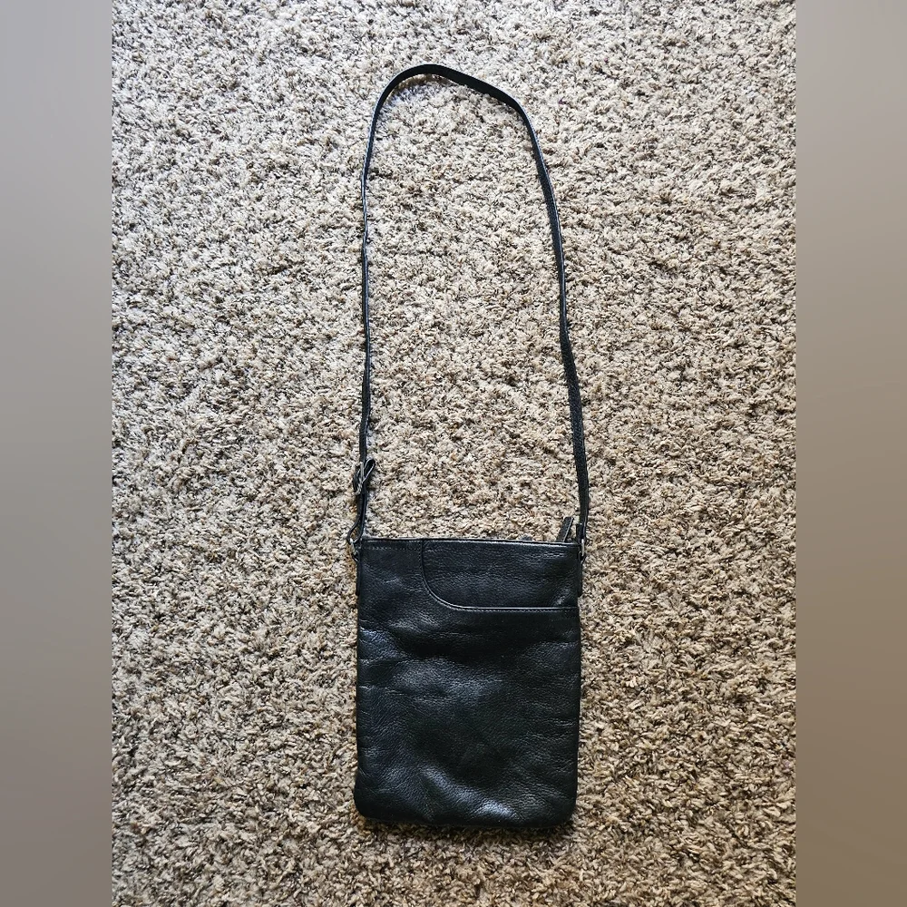 Margot black leather crossbody bag with corner pocket on‎ a front